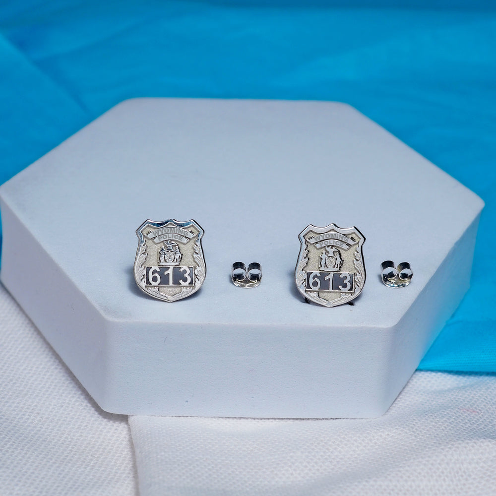 Police badge earrings displayed on a blue presentation card (PG102433, secondary photo 4)
