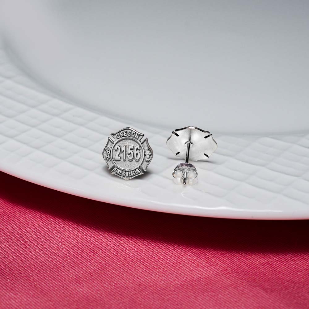 Fire badge earrings displayed on a jewelry dish (PG102545, secondary photo 4)