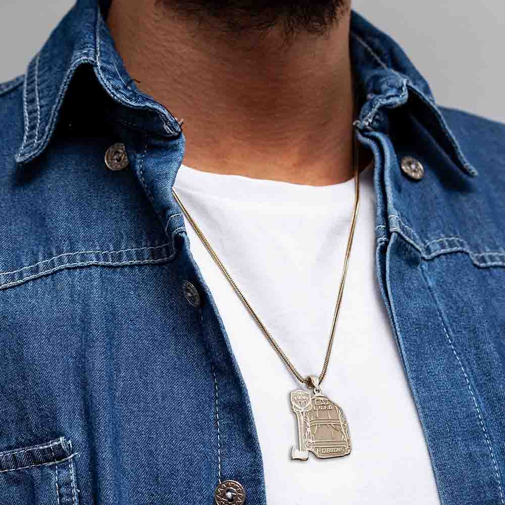 Firefighter uniform pendant necklace worn with a blue denim jacket. (PG102878, secondary photo 2)
