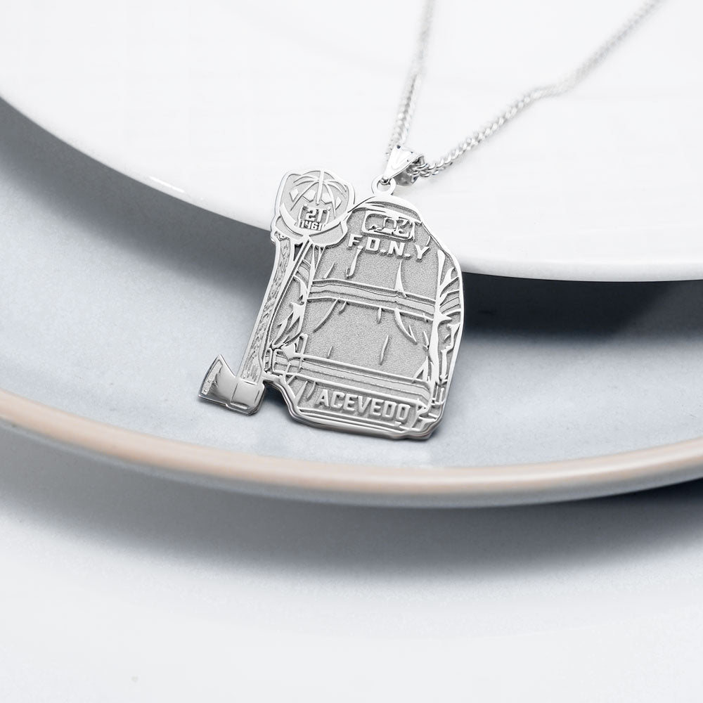 Silver firefighter uniform pendant displayed on a light surface. (PG102878, secondary photo 3)