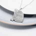 Silver firefighter uniform pendant displayed on a light surface. (PG102878, secondary photo 3)