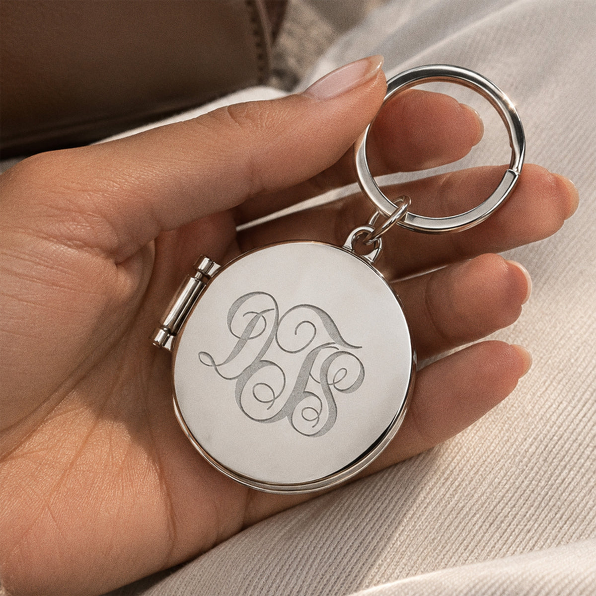 Round Stainless Steel Key Chain Photo Locket - on model