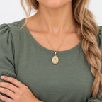 Solid 14K Yellow Gold Floral Oval Photo Locket - on model