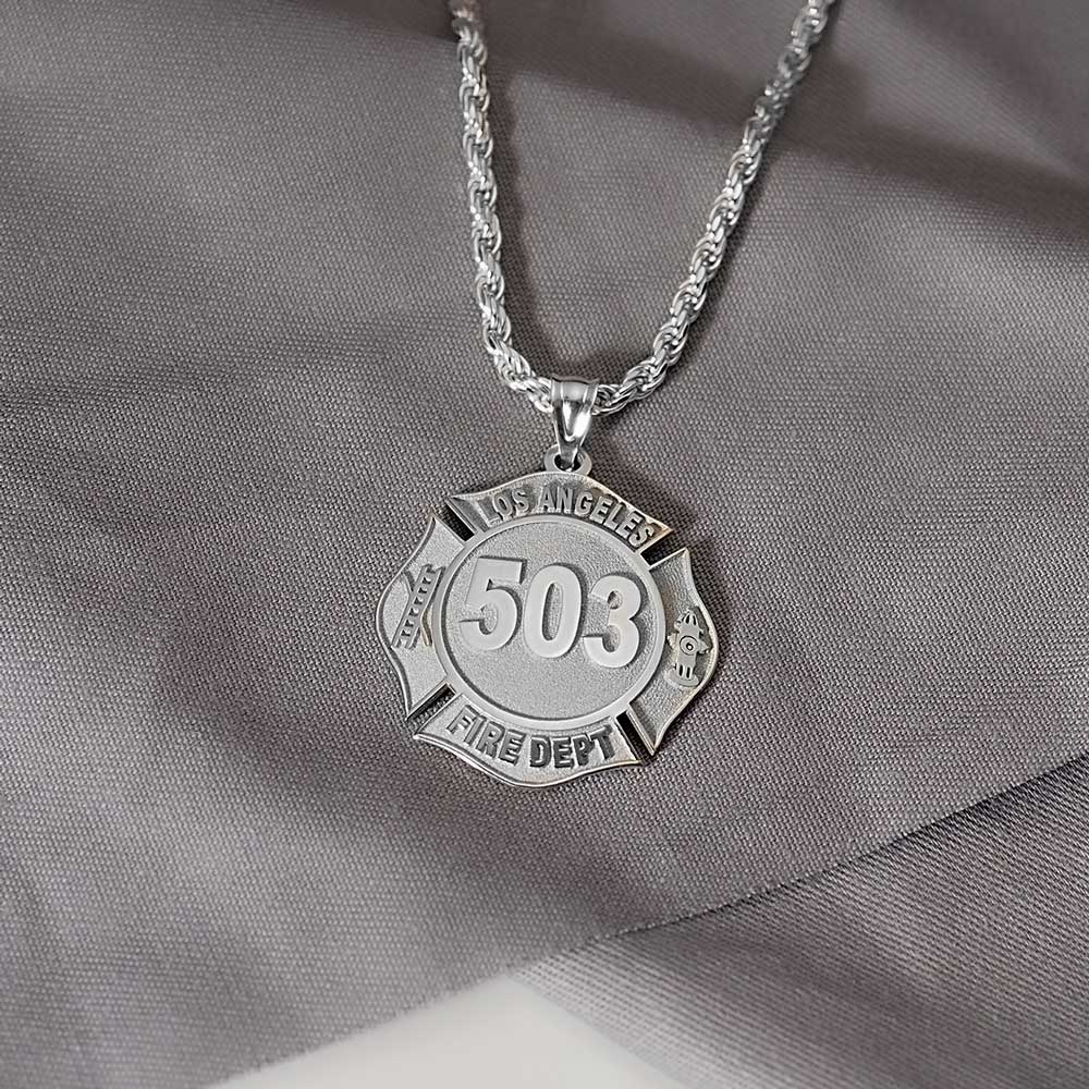 Silver firefighter badge necklace worn with a dark top. (PG71196, secondary photo 4)