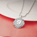 Personalized firefighter badge necklace worn with a red top. (PG71196, secondary photo 5)