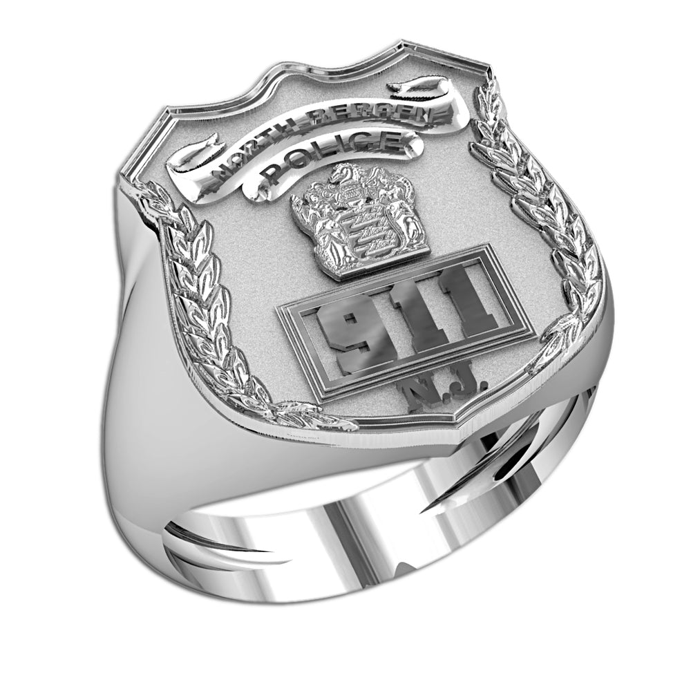 Silver police badge ring in an angled view showing the raised face and band. (PG85987, secondary photo 3)