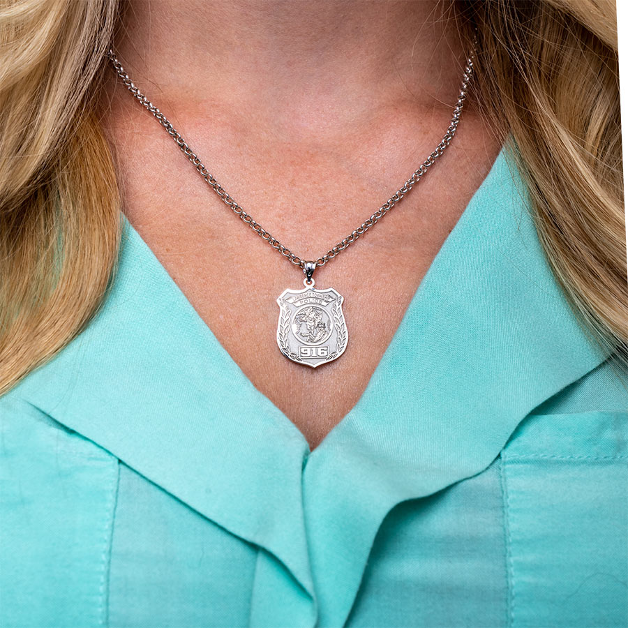 Saint Michael medal necklace worn against a teal top (PG88675, secondary photo 4)