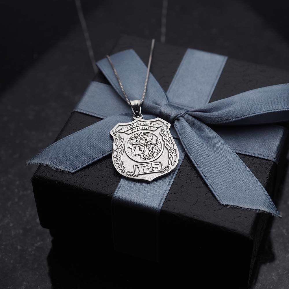 Saint Michael medal pendant displayed against dark fabric (PG88675, secondary photo 9)