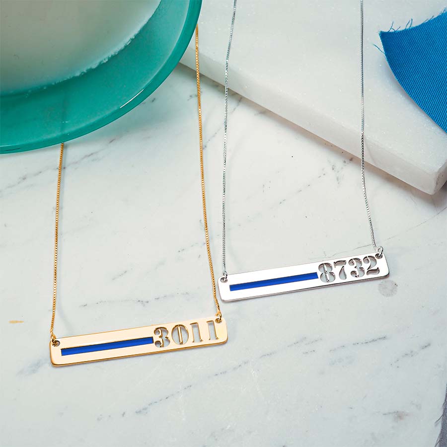Silver and gold thin-blue-line bar necklaces arranged on a light surface (PG93919, secondary photo 7)