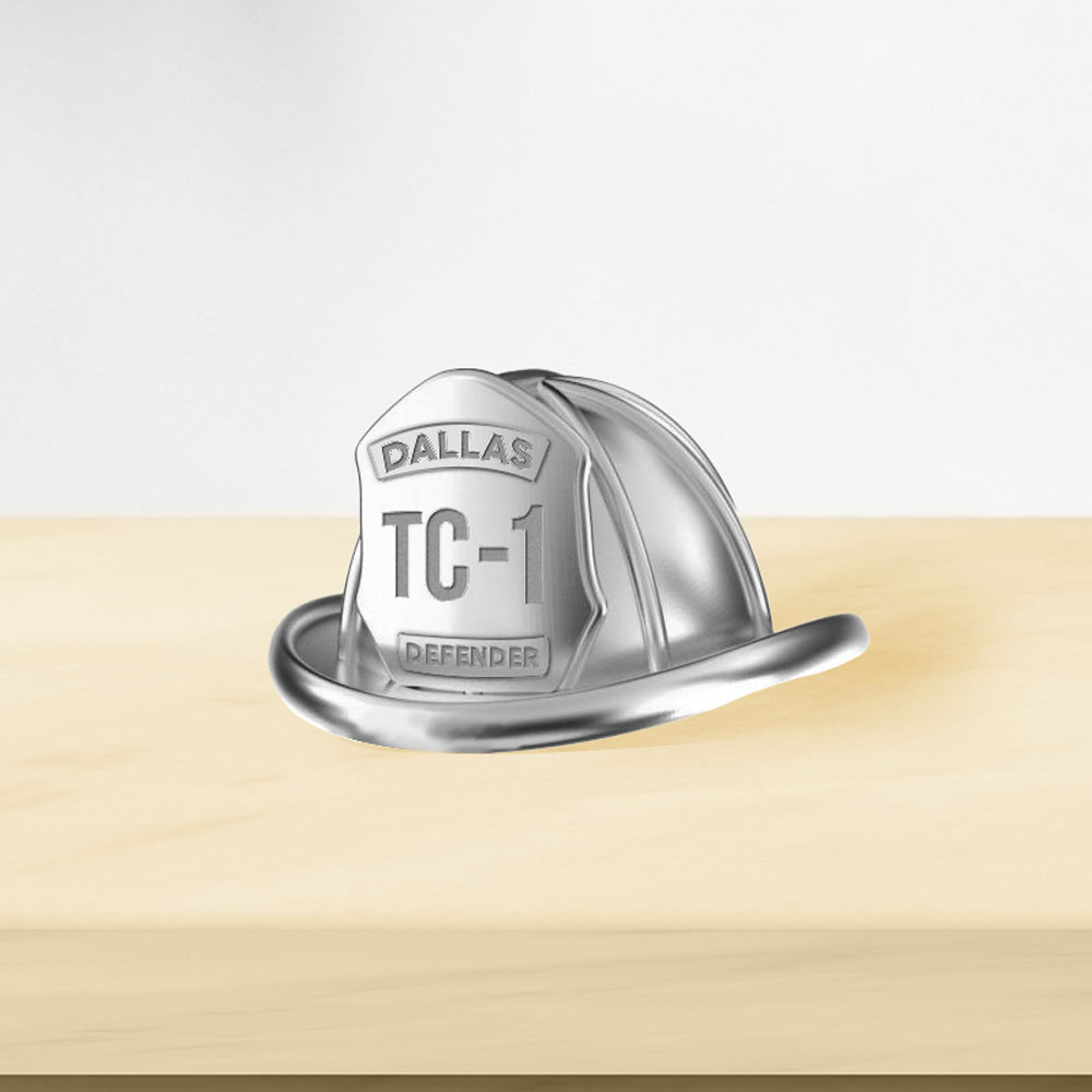 Firefighter helmet pendant shown on a display surface (PG94907, secondary photo 3)