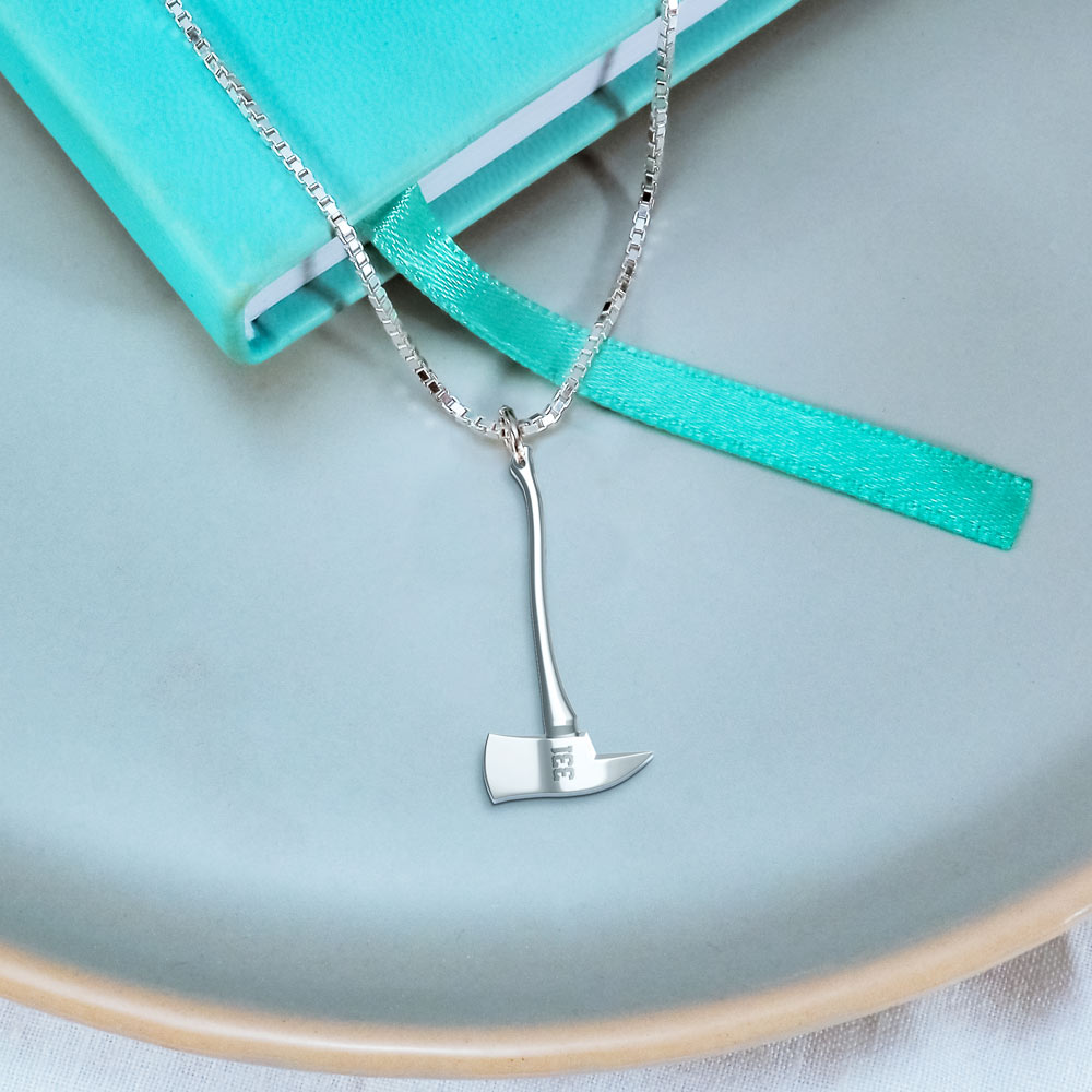 Firefighter axe pendant displayed beside a turquoise jewelry case (PG98576, secondary photo 4)